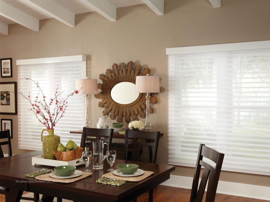 Two dining room windows featuring Lutron sheer blinds.