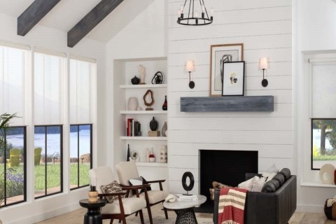 A living room with Lutron’s Palladiom motorized shades partially drawn.