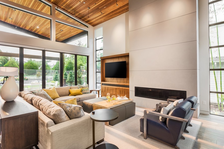 Photo is of a brown living room in a modern smart home.