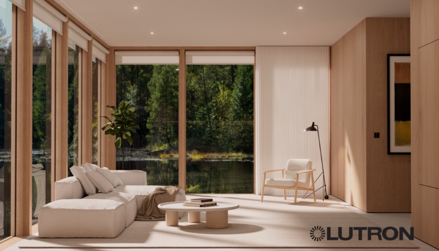 A sitting room with floor-to-ceiling windows with Lutron shades.